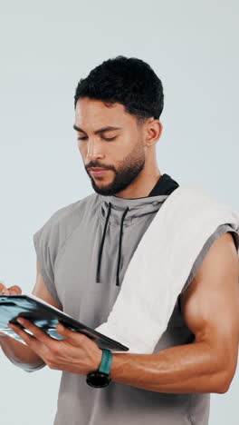 Fitness,-tablet-and-man-in-studio-pointing