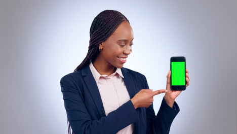Happy-black-woman,-phone-and-pointing-to-green