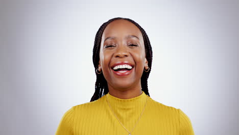 Happy,-face-and-black-woman-in-studio-laughing