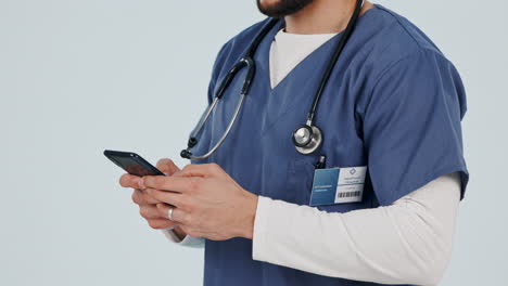 Doctor,-healthcare-and-hands-with-phone-in-studio