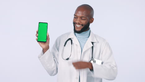 Green-screen,-pointing-and-doctor-with-phone