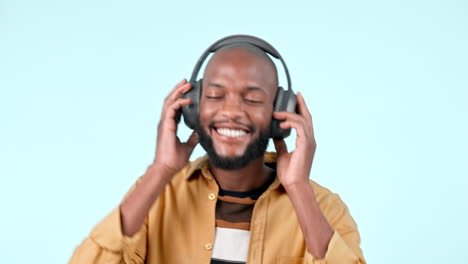 Happy-black-man,-headphones-and-dancing-to-music