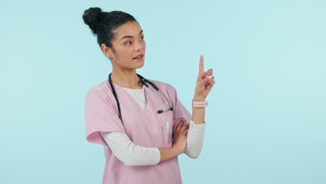 Nurse,-healthcare-and-doctor-in-studio-pointing