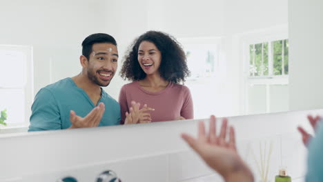 Bathroom,-mirror-and-laughing-couple-with-cream