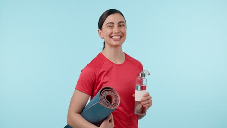 Water,-exercise-mat-and-portrait-a-woman-in-studio