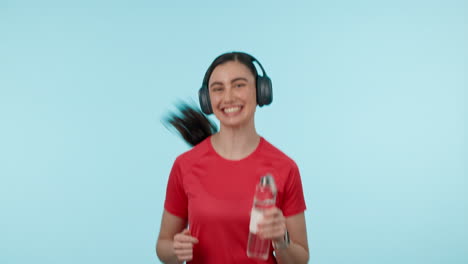 Fitness,-headphones-and-a-woman-with-a-water