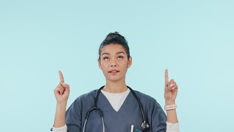 Doctor,-healthcare-and-woman-in-studio-pointing-up