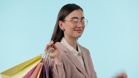 Face,-glasses-and-woman-wink-with-shopping-bag