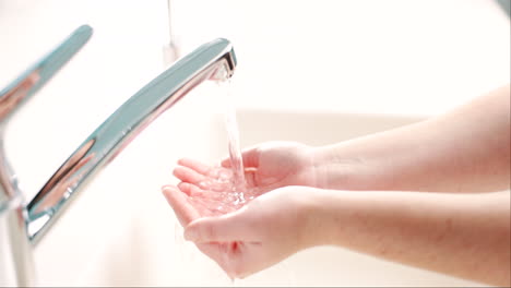 Water,-skincare-and-a-person-washing-hands