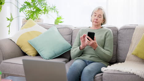 Phone,-senior-woman-typing-on-sofa
