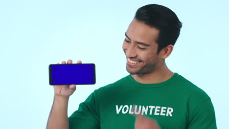 Blue-screen,-mockup-and-volunteer-with-phone