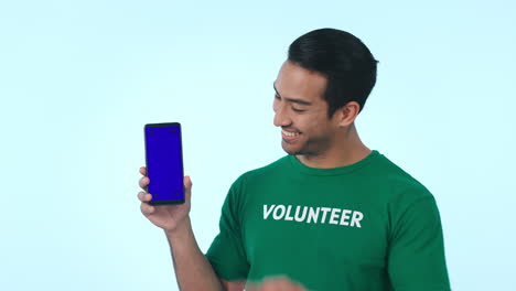 Blue-screen,-phone-and-man-volunteer-pointing-to