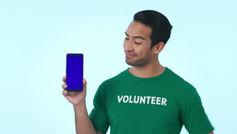 Blue-screen,-cellphone-and-man-volunteer-pointing
