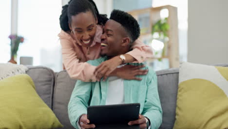 Black-couple,-tablet-and-hug-in-living-room-sofa