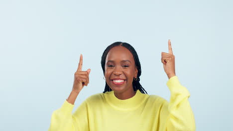 Face,-happy-dance-and-black-woman-pointing-up