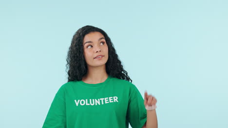 Woman,-happy-face-and-pointing-up-of-volunteer