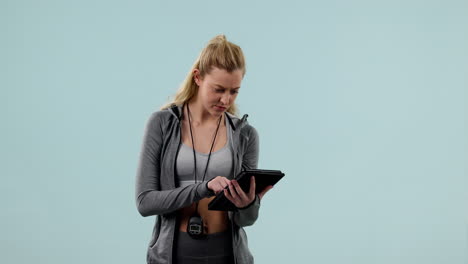 Woman,-typing-and-athlete-research-on-tablet