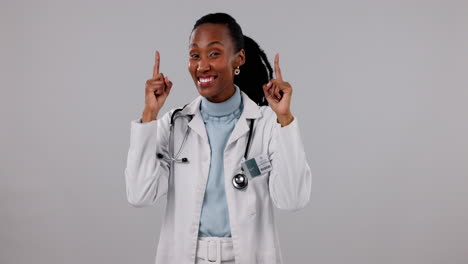 Doctor,-woman-and-pointing-up-in-healthcare
