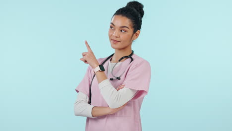 Doctor,-healthcare-and-woman-in-studio-pointing