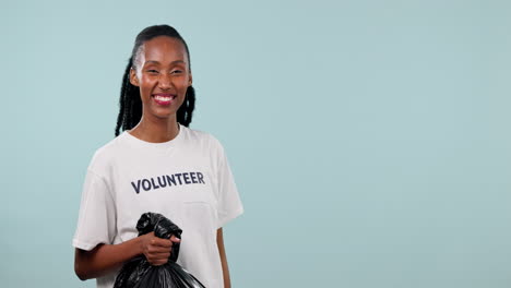 Plastic-bag,-volunteer-and-happy-black-woman-point