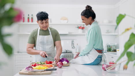 Cooking,-talking-and-vegetables-with-couple