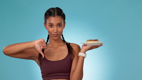 Woman,-cake-and-choice-for-diet-in-studio