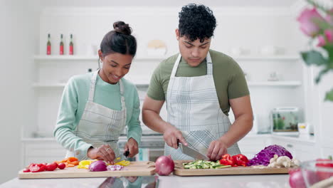 Couple,-cooking-and-vegetable-in-a-home-kitchen
