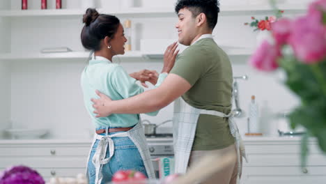 Love,-kiss-and-couple-dance-in-a-kitchen
