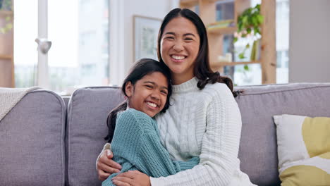 Hug,-face-and-mother-with-girl-child-on-a-sofa