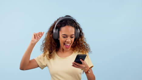 Headphones,-dancing-and-woman-with-a-phone
