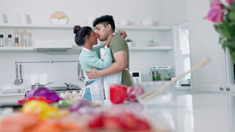 Dance,-love-and-couple-kissing-in-the-kitchen