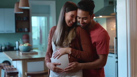 Pregnant-couple,-hug-and-talking-at-night-in-home