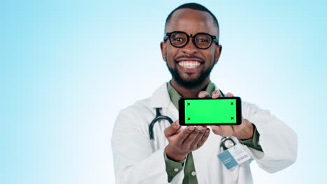 Doctor,-face-and-green-screen-of-phone-in-studio