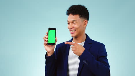 Pointing,-green-screen-and-man-with-a-phone