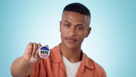 Man,-vote-and-badge-in-hand-for-politics