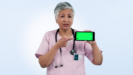 Phone,-green-screen-and-senior-woman-doctor
