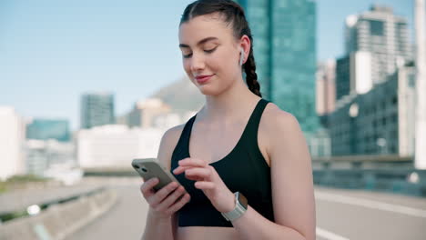 Phone,-fitness-and-woman-typing-in-the-city