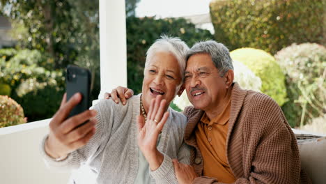 Video-call,-happy-and-senior-couple-in-garden