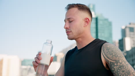 City,-fitness-and-man-drinking-water