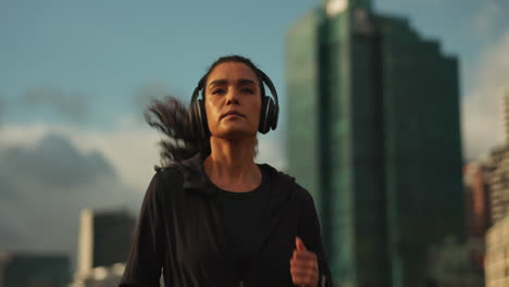 Running,-headphones-and-woman-with-training