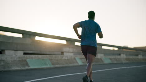 Black-man,-fitness-and-running-on-road-in-sunset