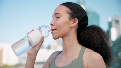 City,-fitness-and-woman-drinking-water