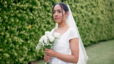 Wedding-in-garden,-portrait-of-bride-with-bouquet