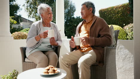 Mature-couple,-happiness-and-coffee-in-garden