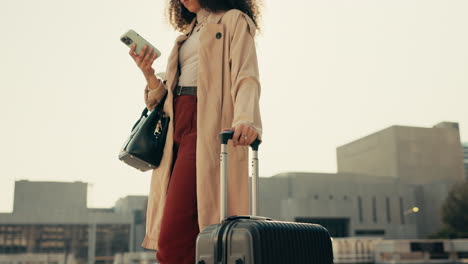 Phone,-suitcase-and-businesswoman-walking