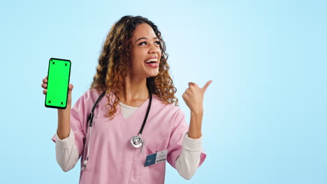 Portrait-of-woman-doctor-pointing-at-phone