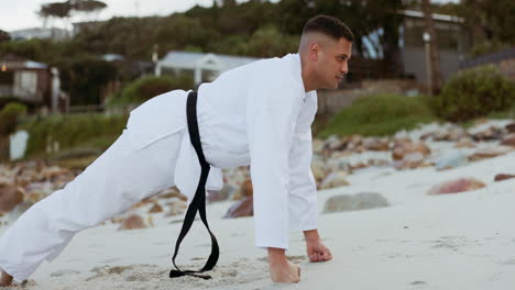 Karate,-man-and-push-ups-on-beach-for-training