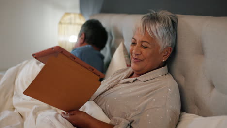 Kiss,-tablet-and-senior-couple-in-bed-networking