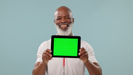 Tablet,-green-screen-and-mature-black-man