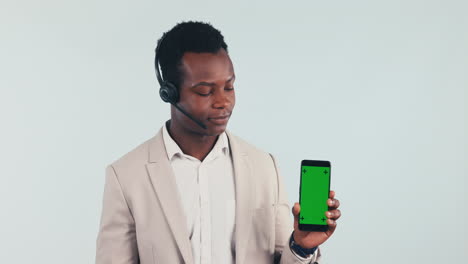 Call-center,-man-and-pointing-to-phone-with-green